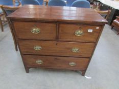 A 2 over 2 mahogany chest of drawers