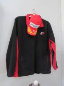 A signed Lewis Hamilton and team mate cap and F1 jacket