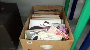 A box of 45 rpm and LP records