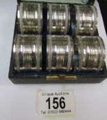 A cased set of 6 plated napkin rings