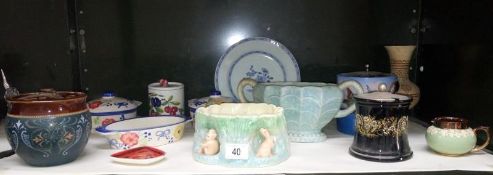 A shelf of miscellaneous china including biscuit barrel