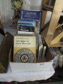 A box of antique reference books