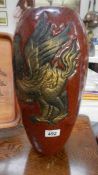 A tall vase decorated with a dragon