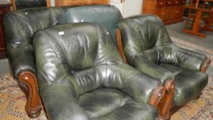 A green leather 3 piece suite with stool