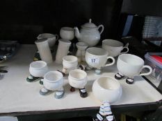 A quantity of novelty cups, egg cups, teapot etc