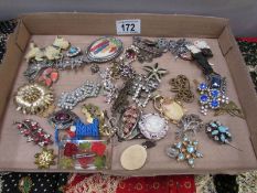 A mixed lot of costume brooches