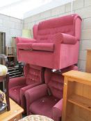 A pink three piece suite