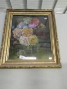 A framed and glazed floral picture