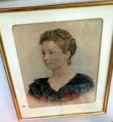 A framed and glazed portrait of a lady