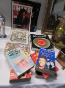 A quantity of Elvis books and show programmes, some autographed
