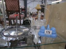 A retro salt and pepper, a cruet set and a plated stand