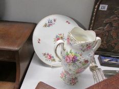 A Royal Worcester cake plate and a Fenton china floral decorated vase