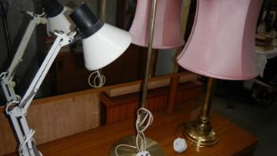A desk lamp, a floor lamp and a table lamp
