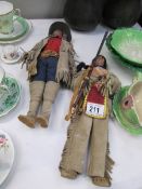 A Cowboy doll and an Indian doll