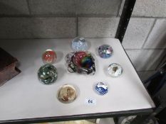 7 glass paperweights and an art glass dish