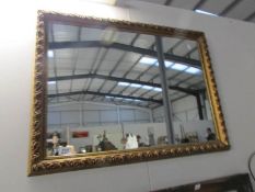 A gilt framed mirror