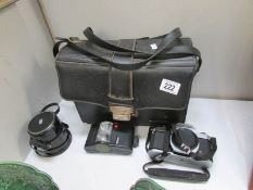 A Pentax K1000 SLR camera, flash, lens and bag