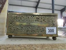 An ornate brass box