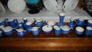 24 pieces of blue souvenir pottery