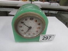 A small green clock