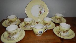 A china tea set, missing sugar bowl