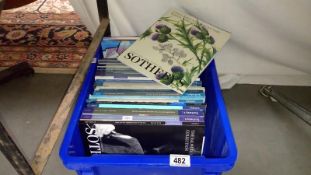 A box of Sotheby's auction catalogues