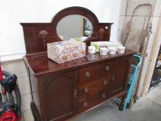 A mahogany mirror backed sideboard