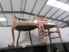 A ladder back chair and a mahogany chair on ball and claw feet