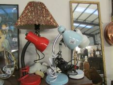 4 desk lamps and a table lamp