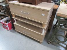 A pair of modern coffee tables with drawers