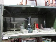 A shelf of glass ware including cake stands, vases etc