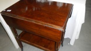 A mahogany tea trolley