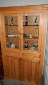 A pine glazed top cabinet