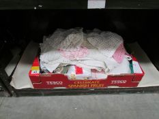 A box of linen and lace etc