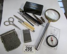 A mixed lot including magnifying glass, pin box, chain purse etc