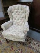 A good quality wing arm chair