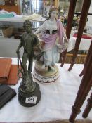 A ceramic figure and a metal figure