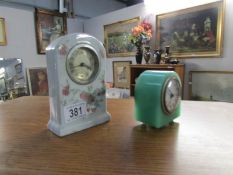 A ceramic clock and a green marble effect clock