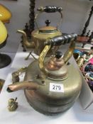 A brass kettle on stand,