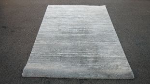 A grey Dunhelm rug,