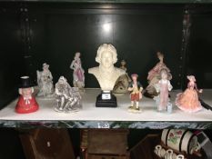 A shelf of assorted figure and a bust etc