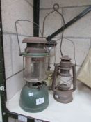 2 Tilley lamps and a hurricane lamp