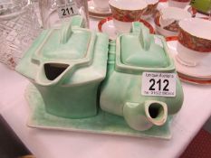 2 art deco teapots on tray