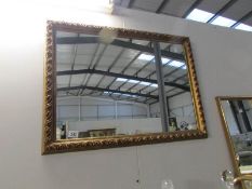 A gilt framed mirror