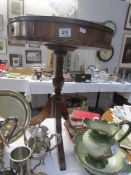 A tripod drum table