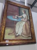 A gilt framed oil on canvas of a lady taking tea