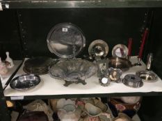 A shelf of metalware