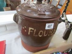 A terracotta flour jar