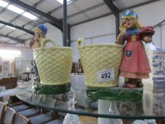 A pair of figural planters