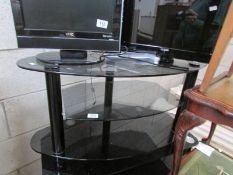 A black glass TV table